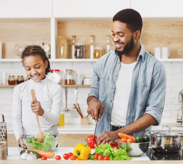 dad and daughter cooking together